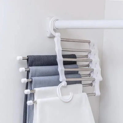 cintre pour pantalon blanc pour ranger 5 pantalons en même temps le cintre se repli pour prendre un minimum de place dans le dressing