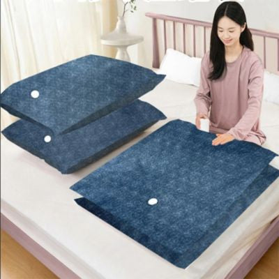 femme assise lit vide air sac vetement sous vide