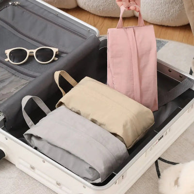 organisateur valise dans valise sac rose beige gris lunette soleil