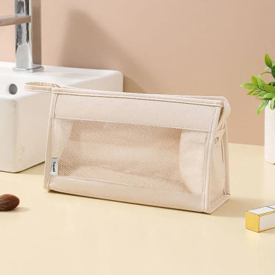 rangement valise beige trousse de maquillage transparente