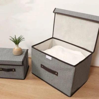 boite de rangement avec couvercle ouvert linge de maison à intérieur