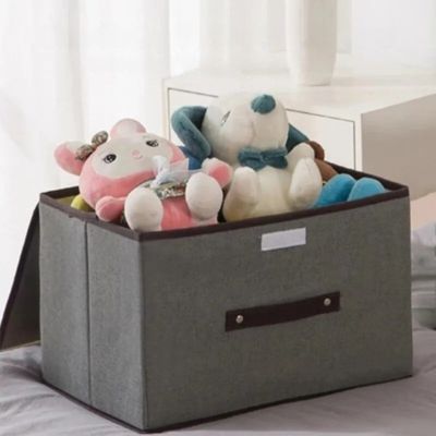 boite de rangement gris taille L rempli de peluche