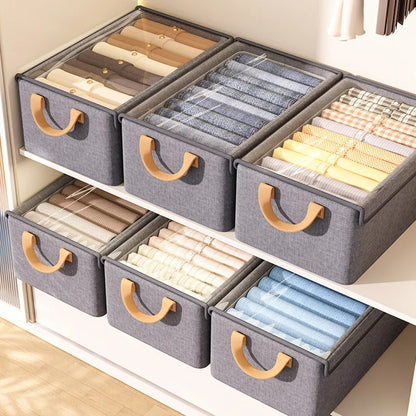 boite de rangement vêtement couvercle transparent poignée alignées étagères armoire