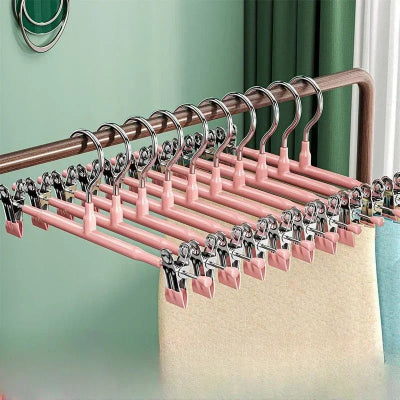 cintre à pantalon rose