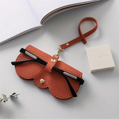 étui à lunettes orange avec lanière