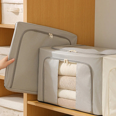 femme range boite de rangement vetement plié gain place
