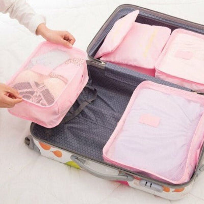 organisateur de valise rose optimisation espace sac voyage facile utilisation