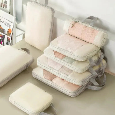 organisateur valise compression vêtement surface lisse nid abeille poignée