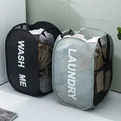 panier a linge gris noir remplit vêtement machine à laver