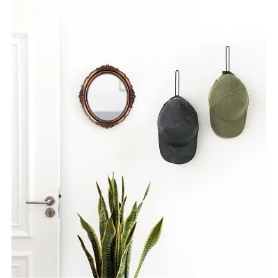 porte casquette mural noir entrée porte miroir plante
